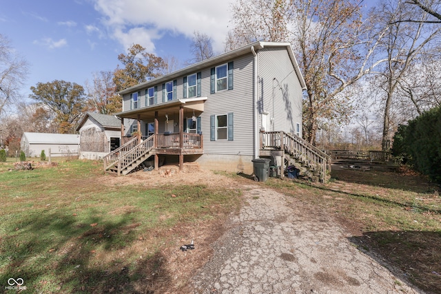 view of front of house with a front lawn and a porch