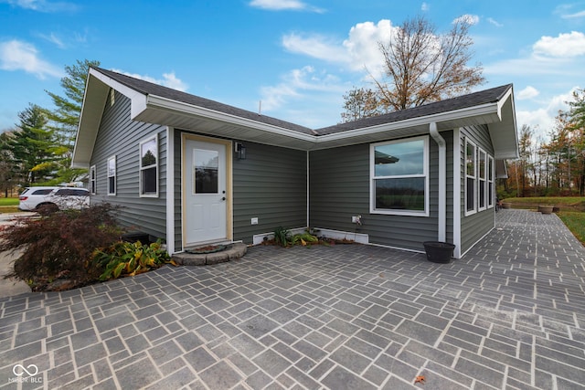 rear view of house featuring a patio