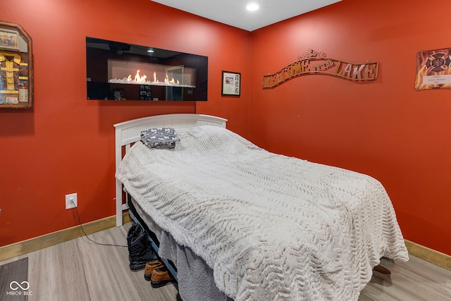 bedroom with light hardwood / wood-style flooring