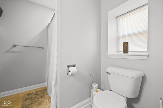 bathroom with tile patterned floors and toilet