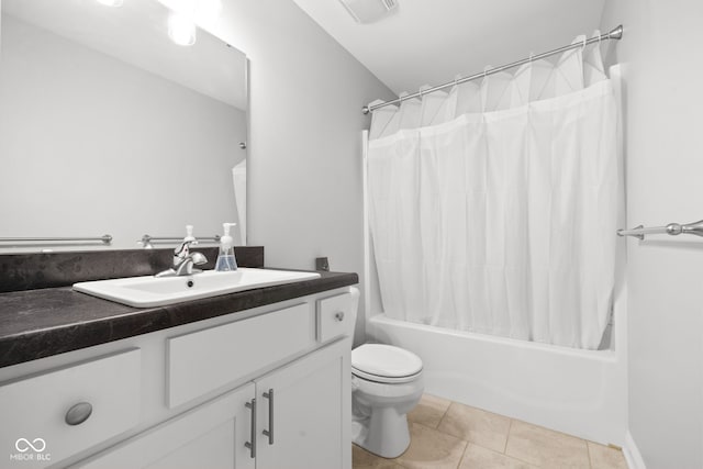 full bathroom featuring vanity, tile patterned flooring, toilet, and shower / tub combo