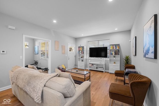 living room with light hardwood / wood-style flooring