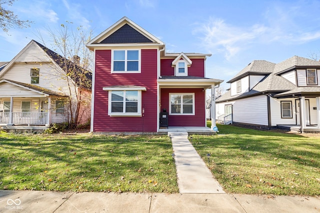 view of front of property with covered porch and a front lawn