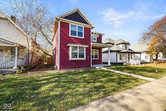 view of front of house with a front lawn and covered porch