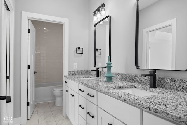 1514 E 12th St, Indianapolis, IN 46201 - bathroom with toilet, double vanity, marble finish flooring, and bathing tub / shower combination
