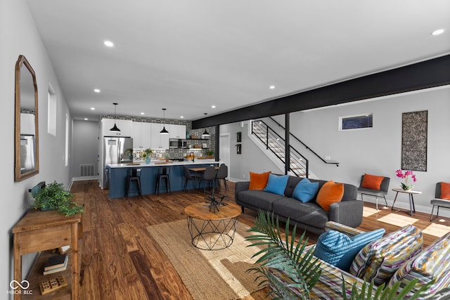 1514 E 12th St, Indianapolis, IN 46201 - living area featuring dark wood-style floors, recessed lighting, baseboards, and stairs