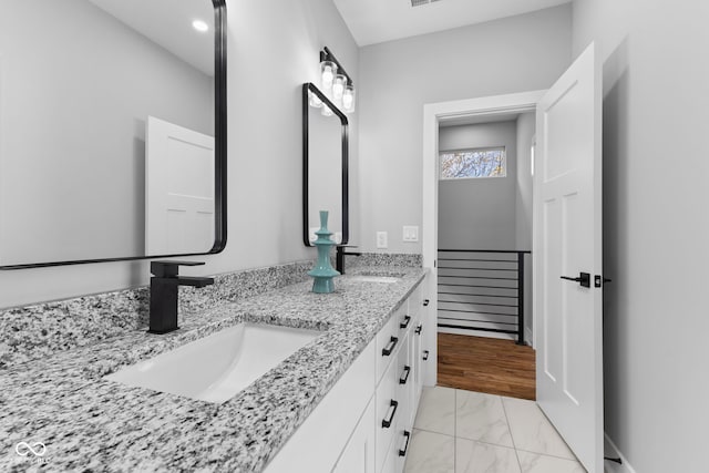 1514 E 12th St, Indianapolis, IN 46201 - bathroom featuring marble finish flooring and double vanity
