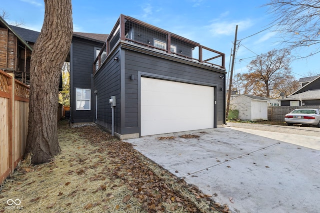 1514 E 12th St, Indianapolis, IN 46201 - view of front of house featuring driveway and an attached garage