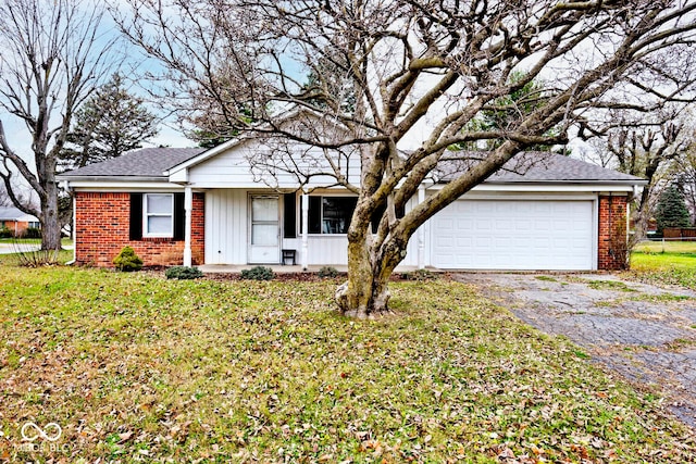 single story home featuring a garage and a front yard