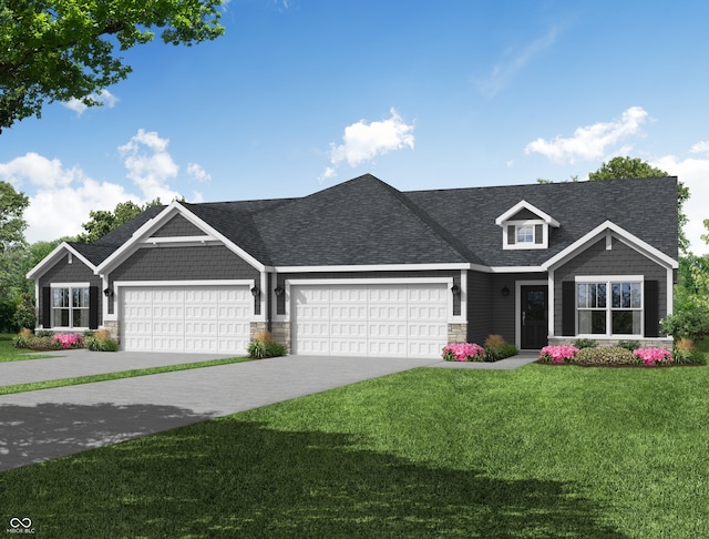 view of front of property featuring a front lawn and a garage