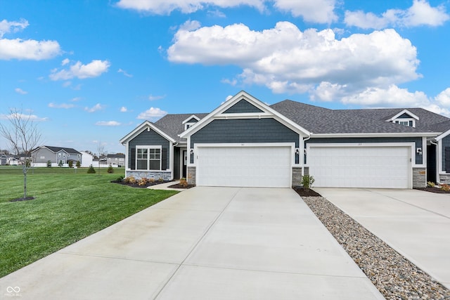 view of front of home featuring a garage and a front yard