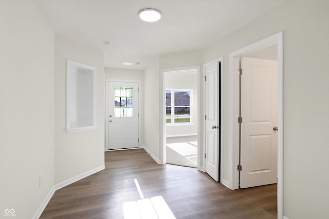 doorway with hardwood / wood-style flooring