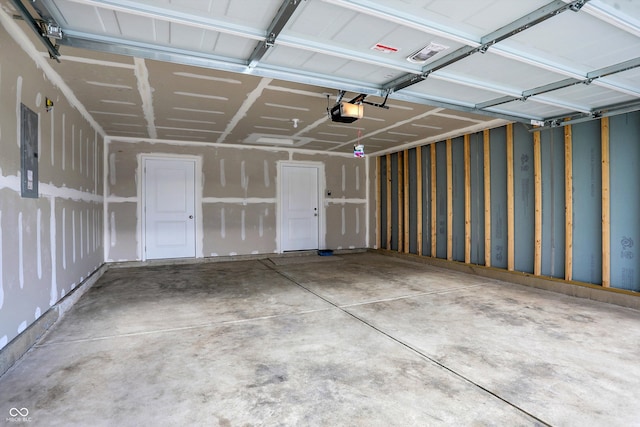 garage featuring a garage door opener and electric panel