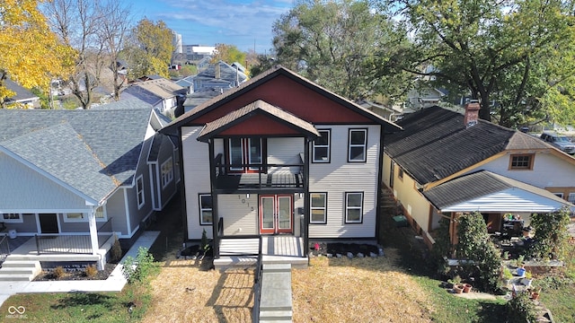 view of front of property featuring a balcony