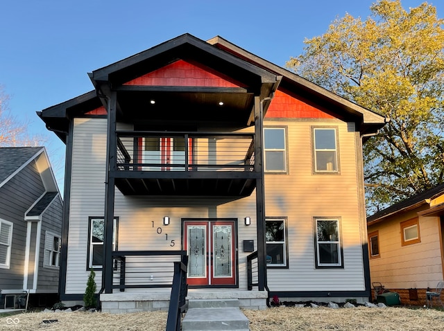 view of front of home featuring a balcony