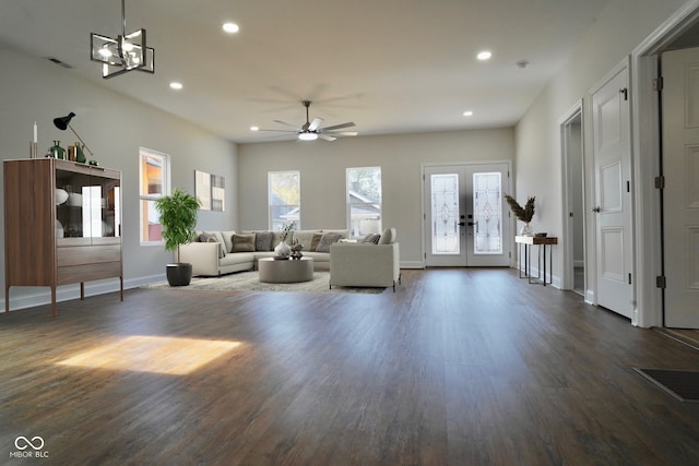 living room featuring dark hardwood / wood-style floors, ceiling fan, and french doors