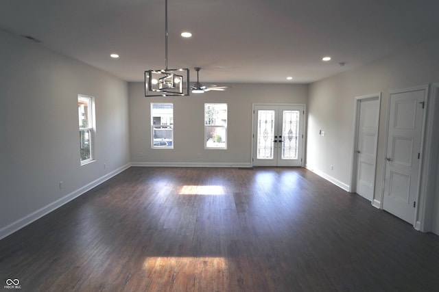 interior space with ceiling fan, french doors, and dark hardwood / wood-style floors