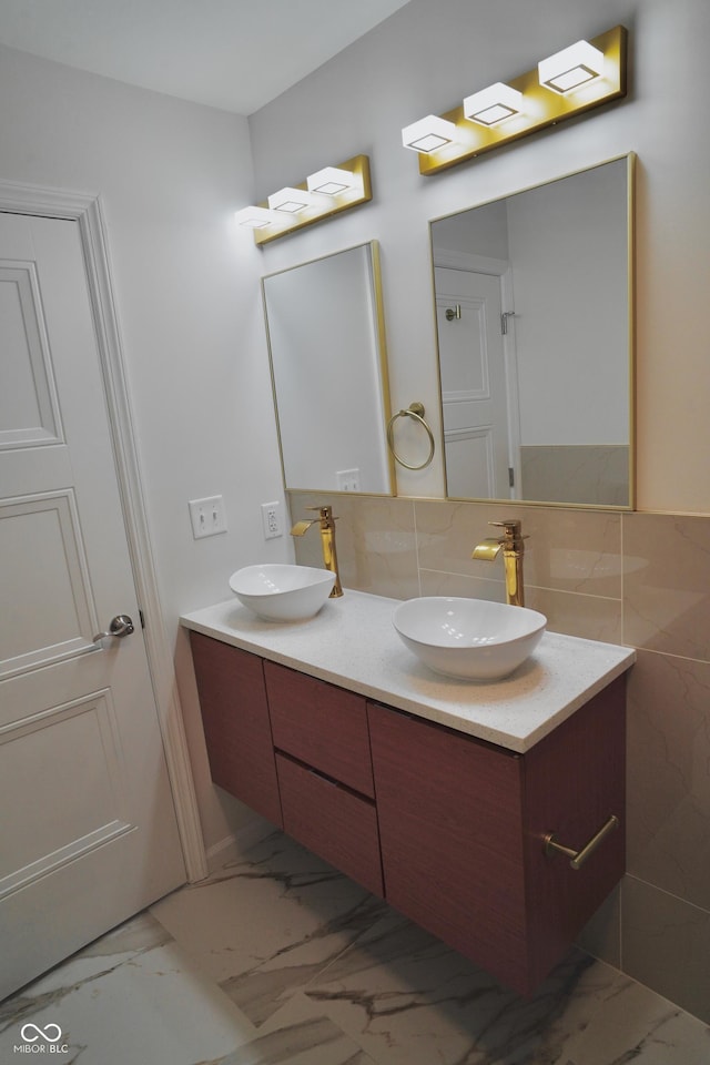 bathroom featuring vanity and backsplash