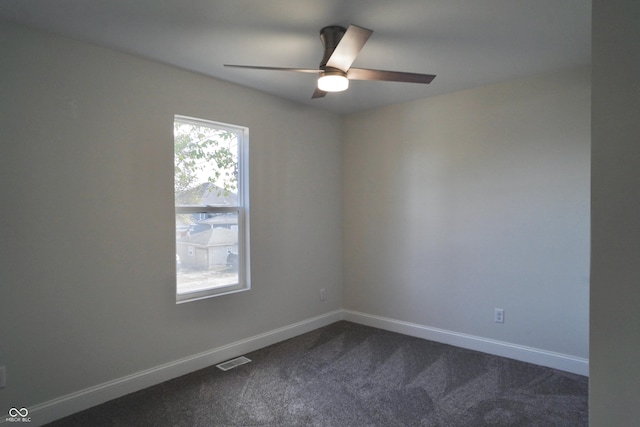 carpeted empty room featuring ceiling fan