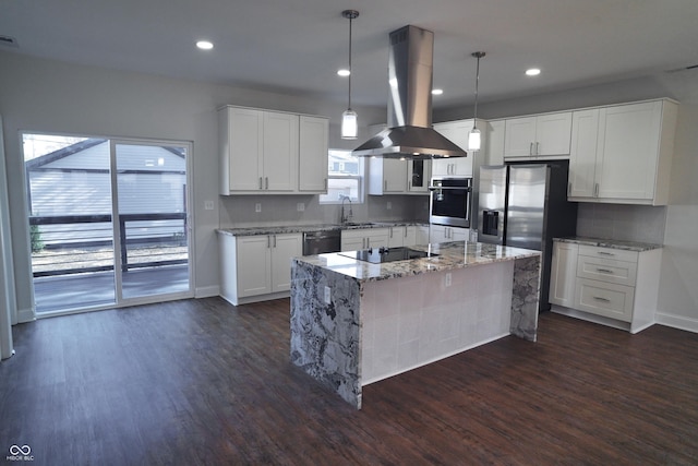 kitchen featuring decorative light fixtures, dark hardwood / wood-style floors, white cabinetry, and island exhaust hood