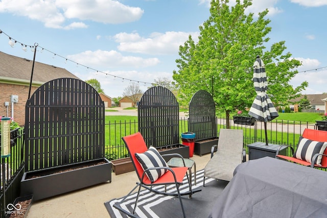 view of patio featuring fence
