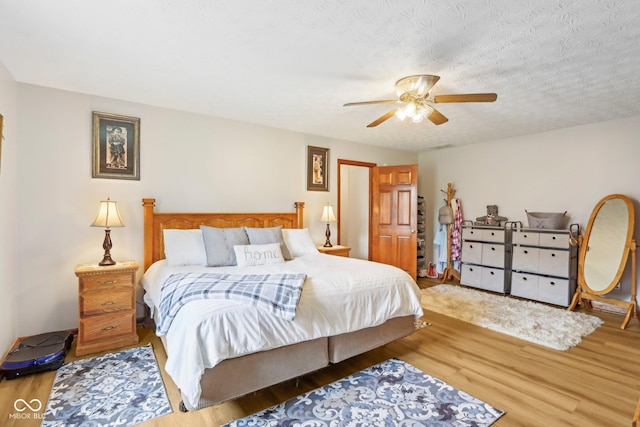 bedroom featuring wood finished floors and ceiling fan