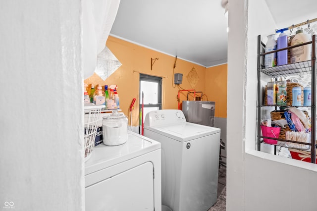 laundry room featuring washer and clothes dryer and water heater