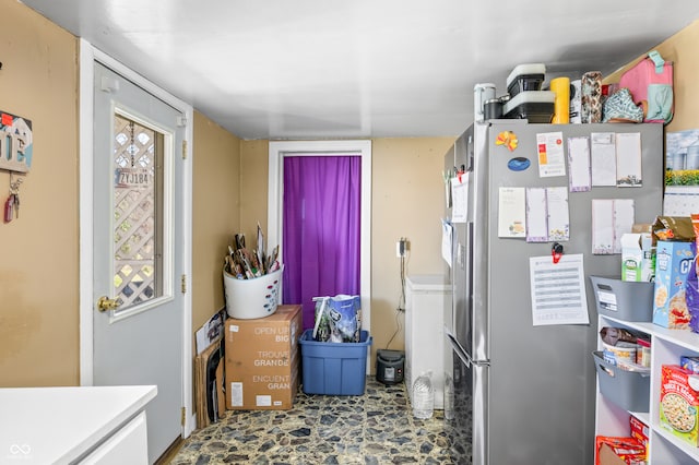 kitchen featuring stainless steel fridge