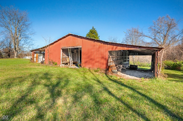 view of outbuilding with a yard