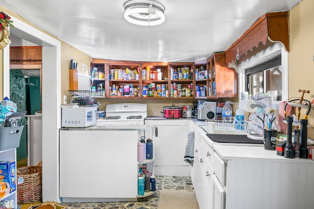 kitchen with white cabinets and white appliances