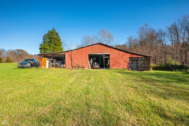 view of outbuilding featuring a yard