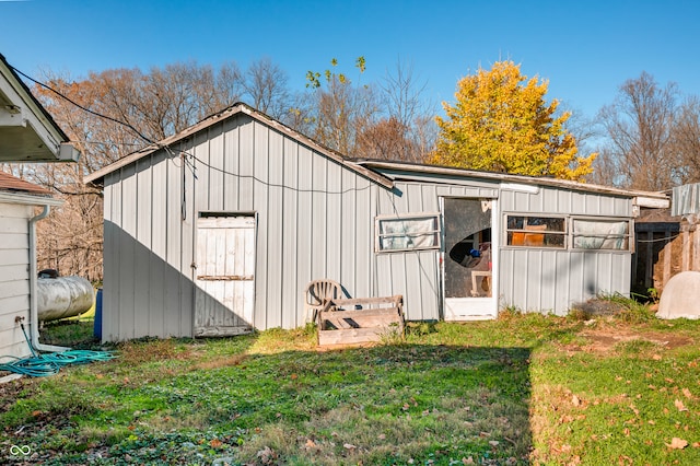 view of outdoor structure with a lawn