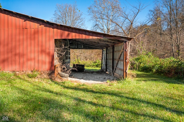 view of outbuilding featuring a yard