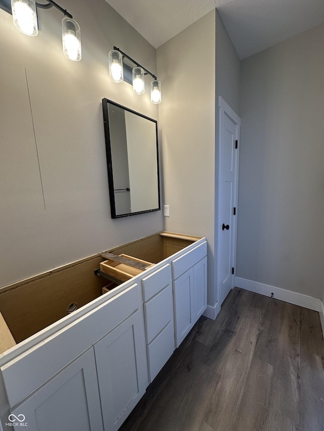 bathroom with wood-type flooring