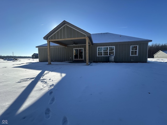 snow covered house with ceiling fan