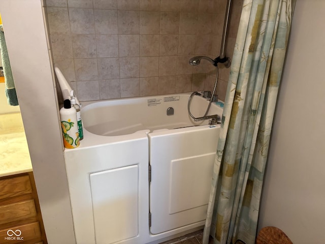 bathroom featuring vanity and shower / tub combo