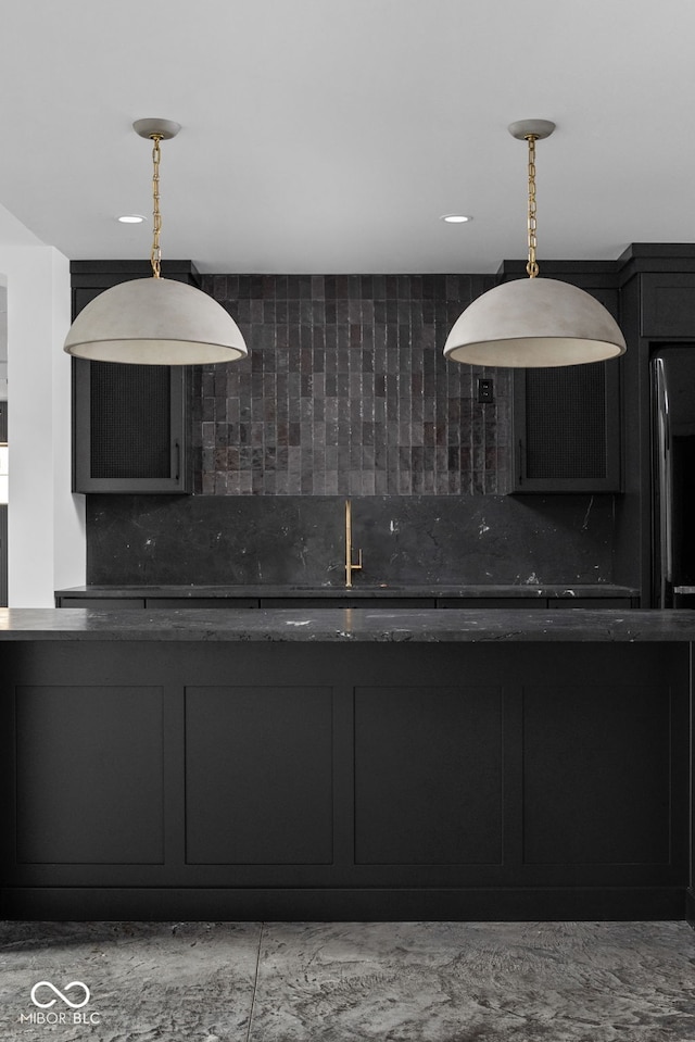 kitchen with backsplash and decorative light fixtures