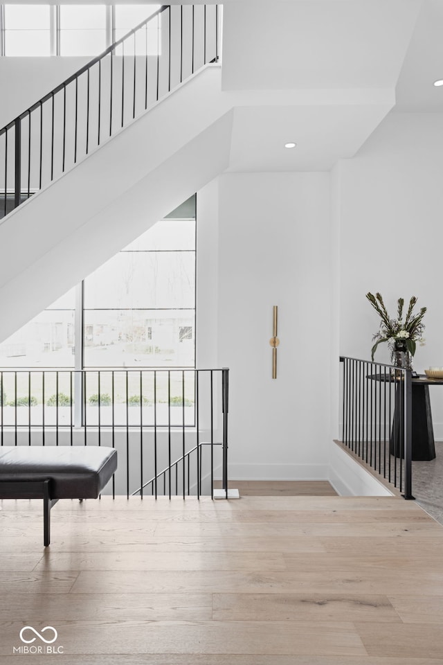 staircase with wood-type flooring