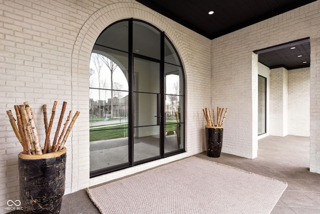 doorway with brick wall