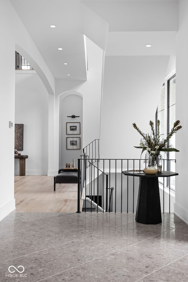 corridor with hardwood / wood-style floors