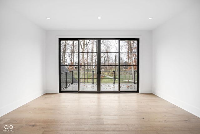 unfurnished room featuring light hardwood / wood-style floors