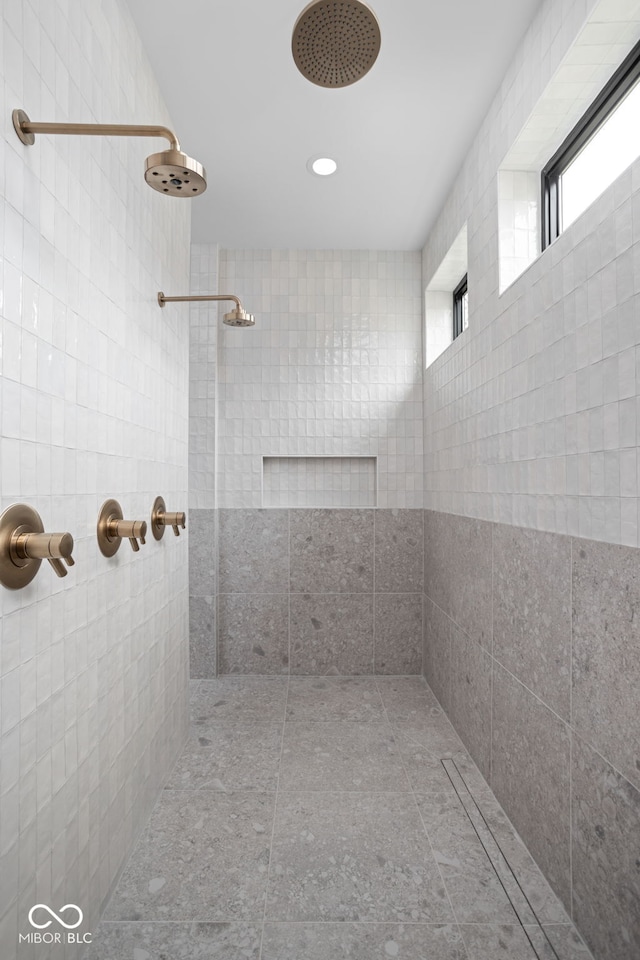 bathroom with tiled shower