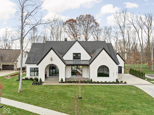 french country home featuring a front yard