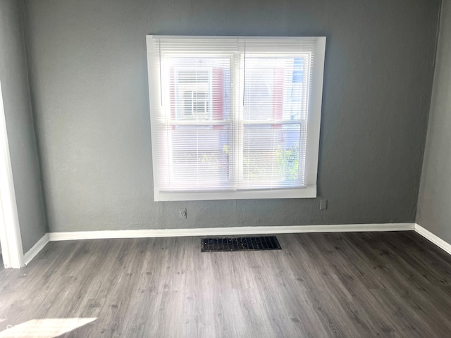 empty room featuring hardwood / wood-style flooring