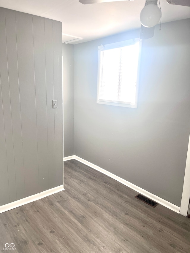 unfurnished room with wood-type flooring