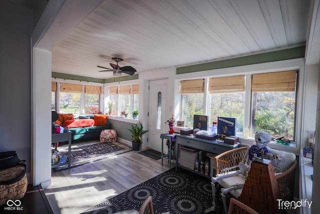 sunroom / solarium with ceiling fan and a healthy amount of sunlight