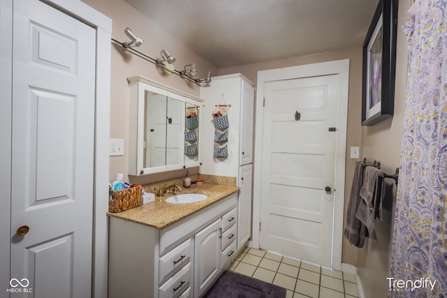 bathroom with vanity and tile patterned floors