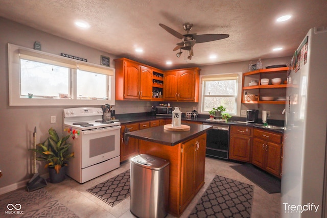 kitchen featuring white range with electric cooktop, dishwasher, a textured ceiling, ceiling fan, and a kitchen island