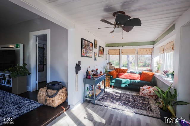 sunroom / solarium featuring ceiling fan