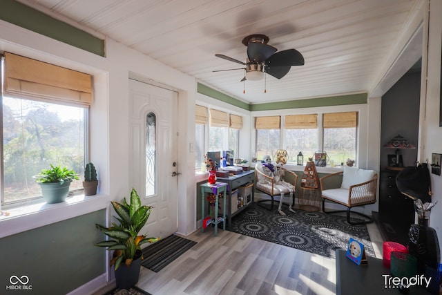 sunroom / solarium with ceiling fan and plenty of natural light